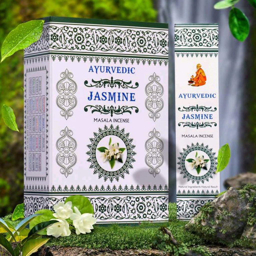 Ayurvedic Jasmine masala incense packaging with green leaves and flowers in the background