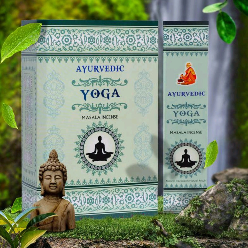 Ayurvedic Yoga incense packaging with green leaves and a statue in the background