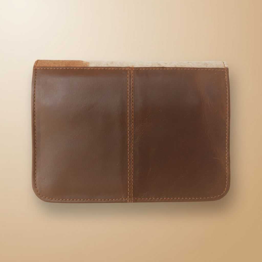 Brown leather notebook on a light gray surface