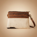 Brown and white leather clutch bag on a beige background