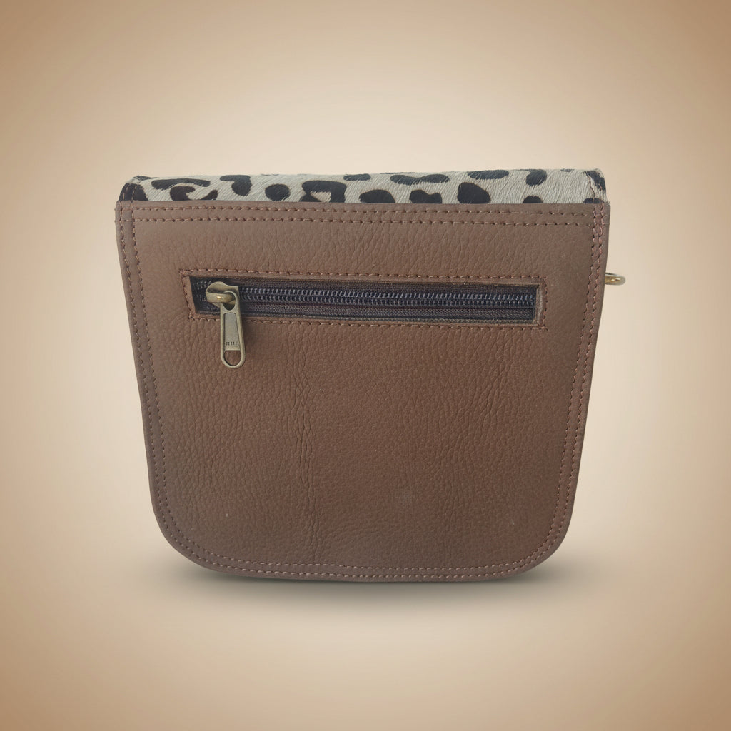 Brown leather wallet with leopard print zipper on a white background