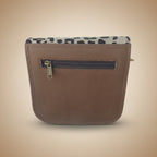 Brown leather wallet with leopard print zipper on a white background