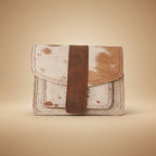 Vintage-style leather wallet with brown strap on a textured gray background