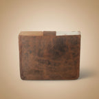 Brown leather-bound book on a white background