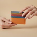 Multicolored striped wallet on a light gray background