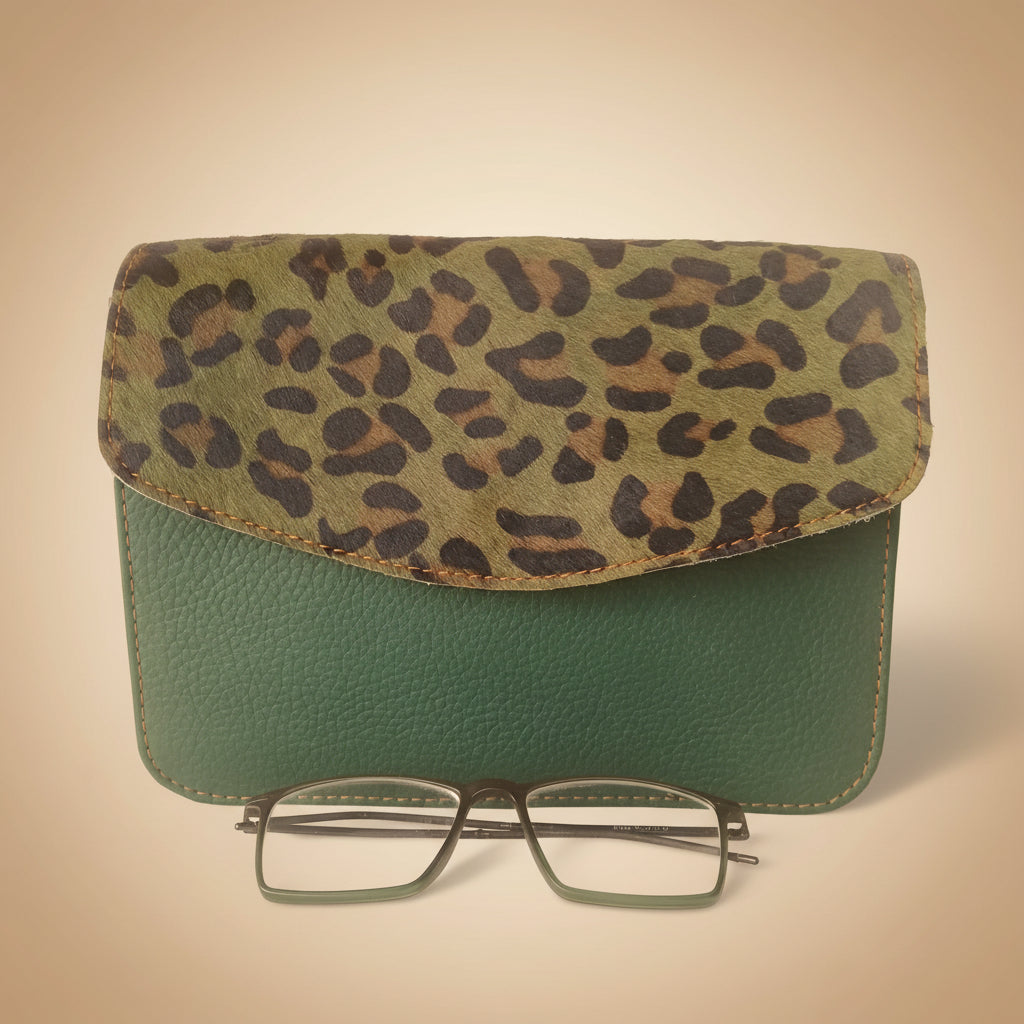 Leopard print case and green textured case with glasses on a white background