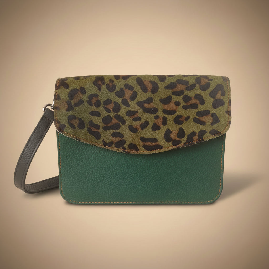Green wallet with leopard print flap on a white background