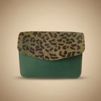 Leather wallet with leopard print flap on a white background