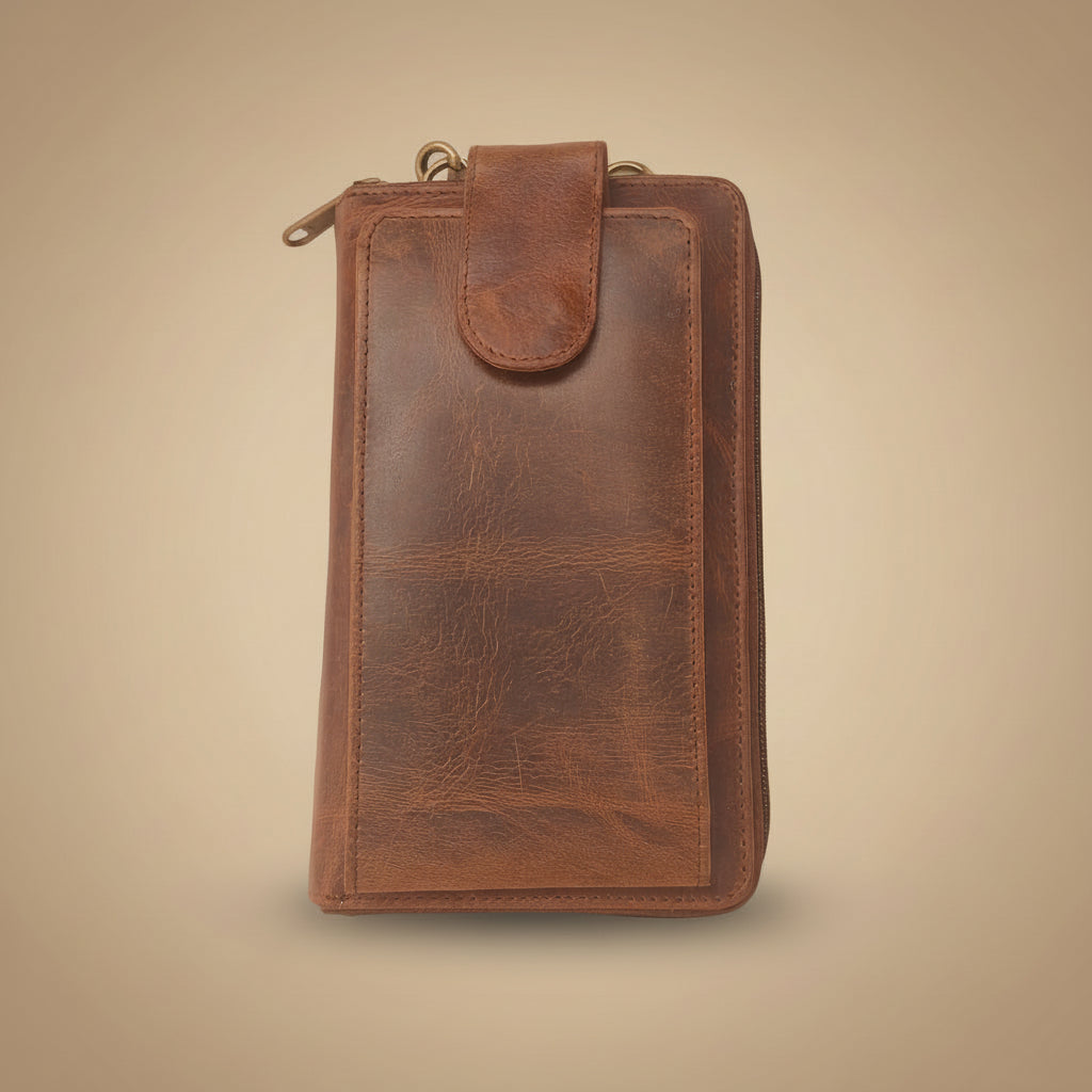 Brown leather pouch on a beige background