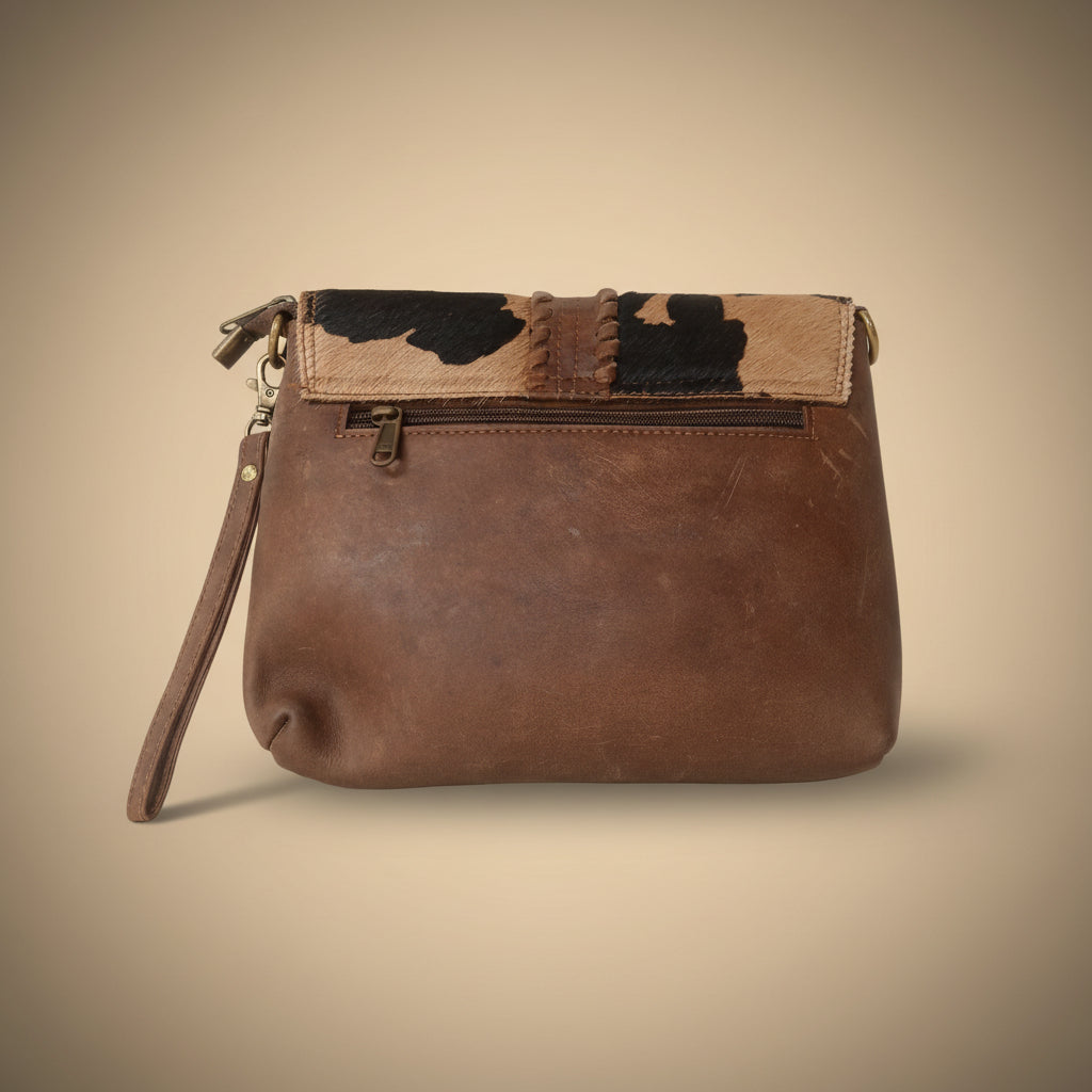 Brown leather clutch bag with camouflage pattern on a white background
