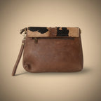 Brown leather clutch bag with camouflage pattern on a white background