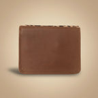 Brown leather wallet on a light gray background