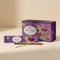 Himalaya Black Opium incense packaging with incense sticks on a beige background