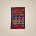 Colorful patterned rug on a white surface