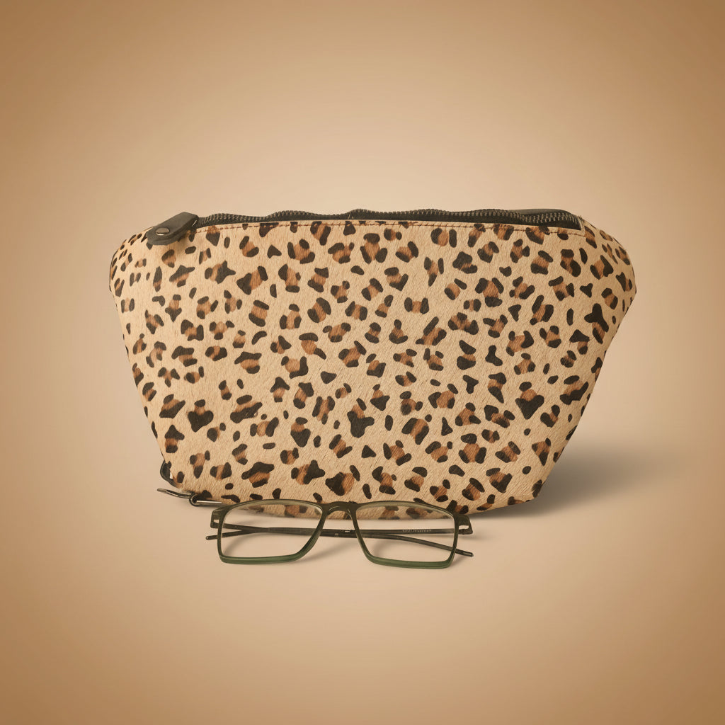 Leopard print case with a pair of glasses on a white background