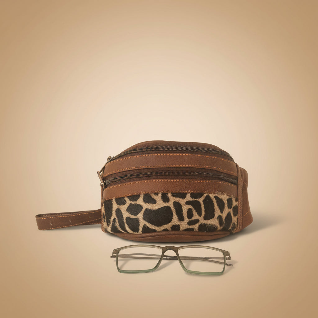 Leopard print and brown zippered pouch with a pair of glasses on a white background