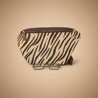 Zebra patterned pouch with a pair of glasses on a white background
