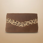 Brown wallet with leopard print strap on a light gray background