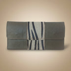 Gray leather wallet with zebra pattern on a light gray background
