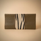 Two-tone wallet with one side having a zebra pattern on a white background