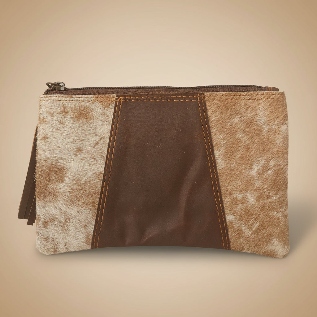 Pouch with brown and beige cowhide leather design on a beige background