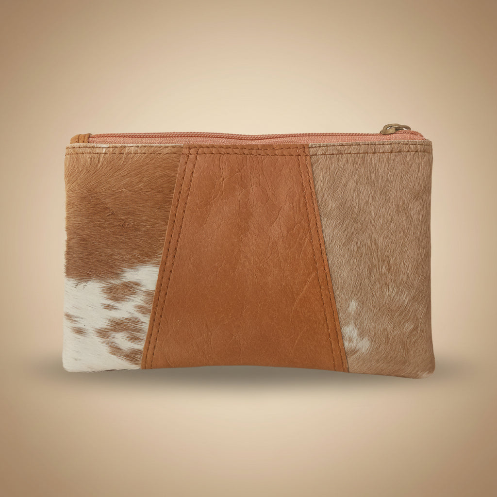 Brown leather wallet with cowhide pattern on a white background