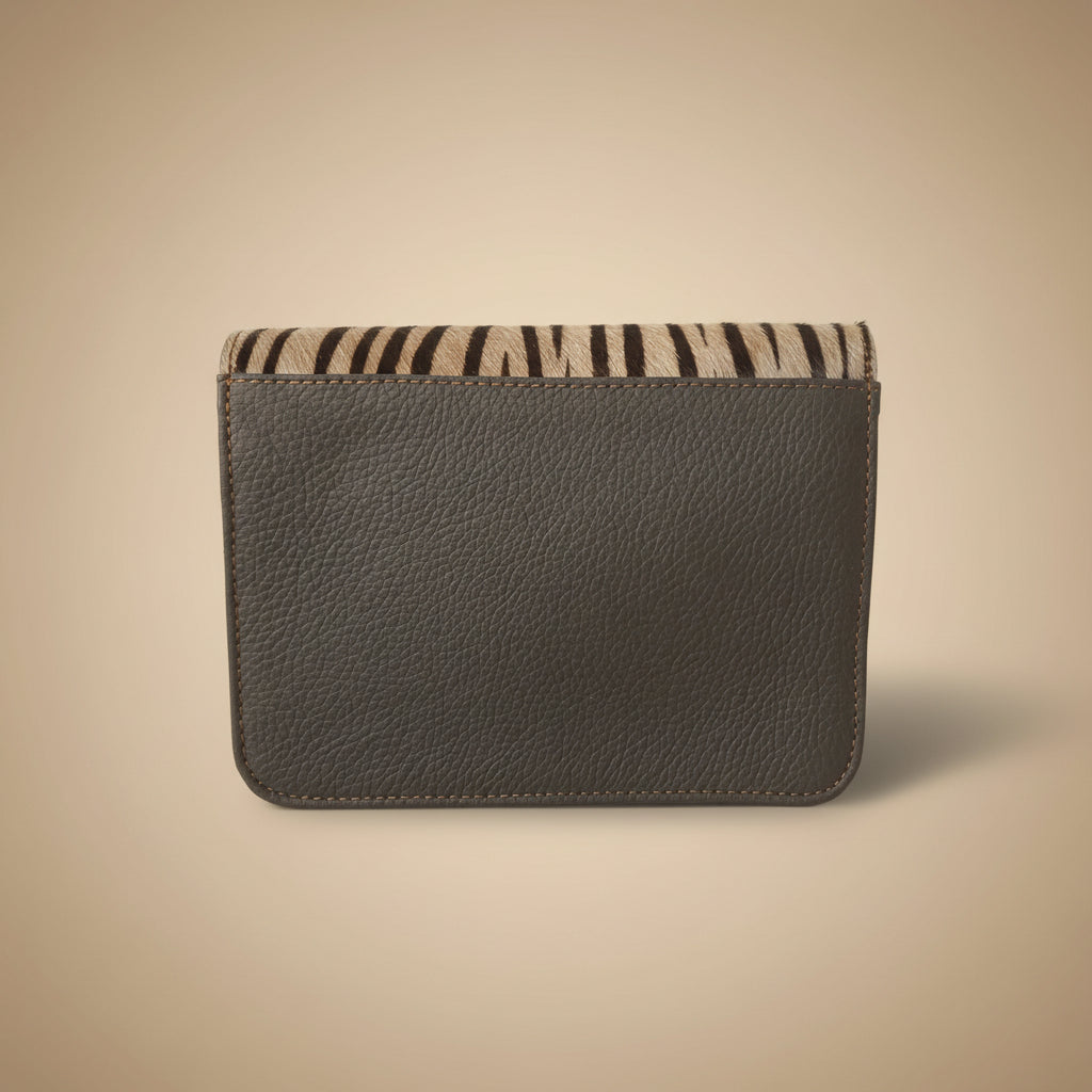 Gray leather case with zebra pattern on a white background