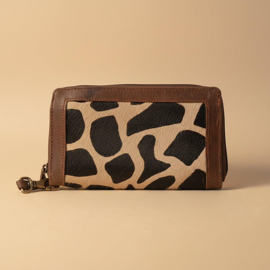 Wallet with giraffe pattern on a light gray background
