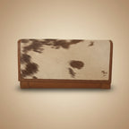 Wallet with cowhide pattern on a white background