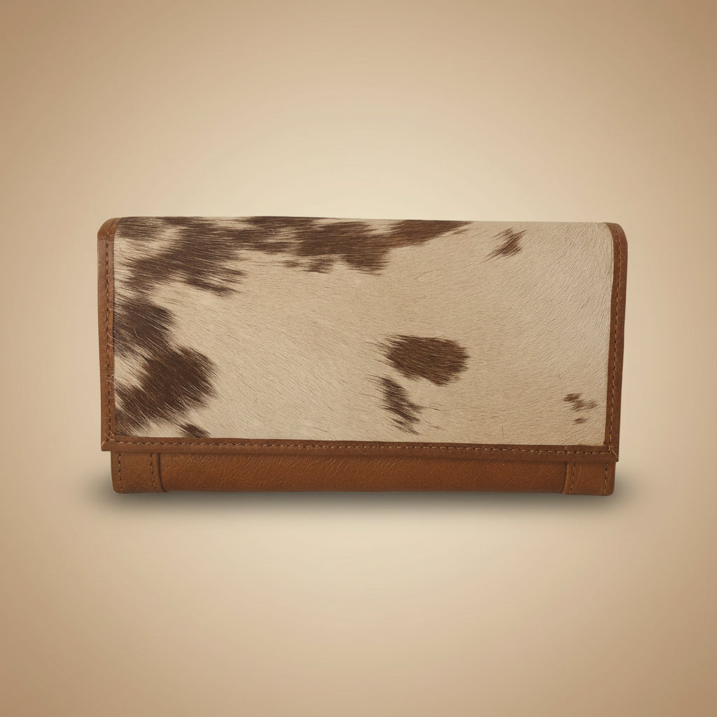 Wallet with cowhide pattern on a white background
