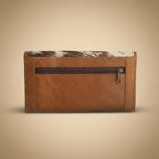 Brown leather wallet with a zipped pocket on a light gray background