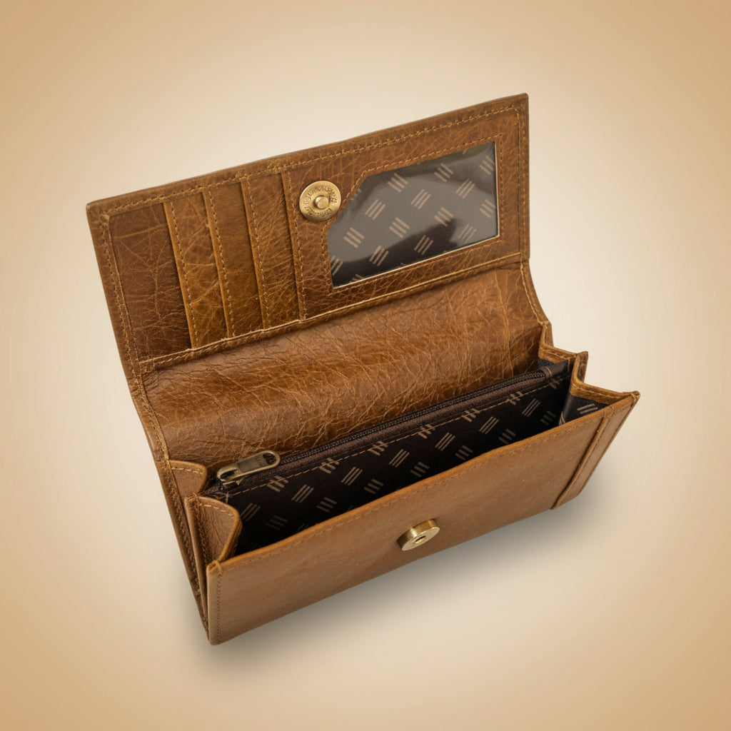 Brown leather wallet with a patterned flap on a light blue background