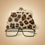 Leopard print case with glasses on a light gray background