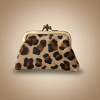 Leopard print coin purse on a light gray background