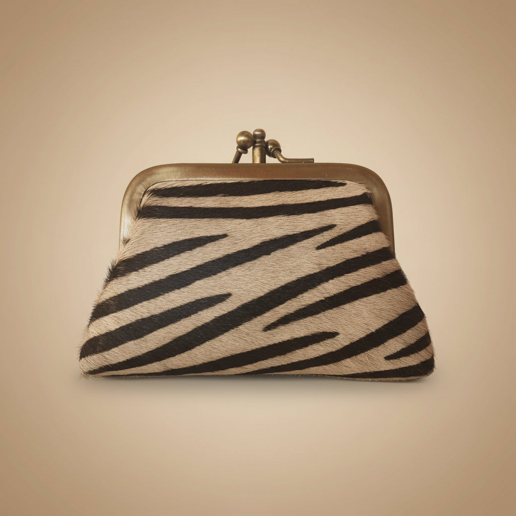 Small pouch with zebra pattern on a light gray background