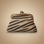 Small pouch with zebra pattern on a light gray background