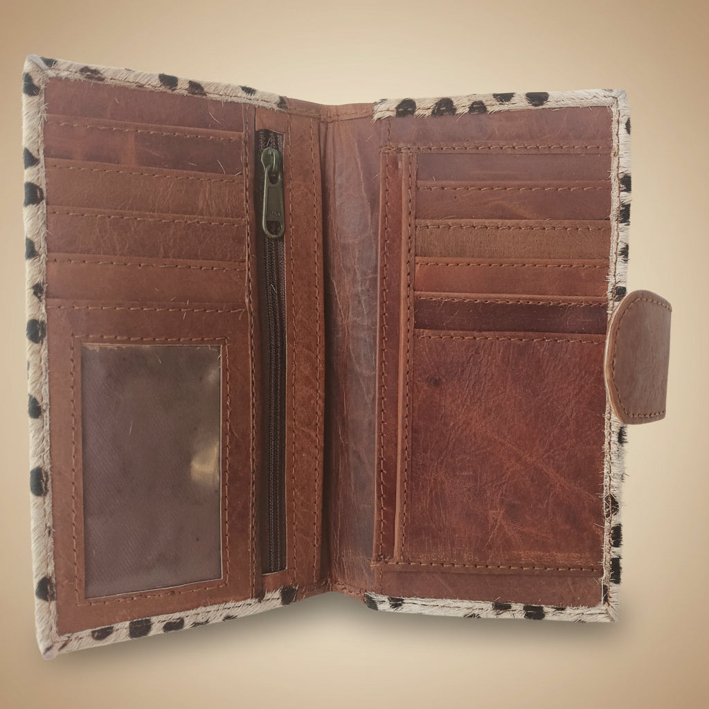 Brown leather wallet with a patterned flap on a white background