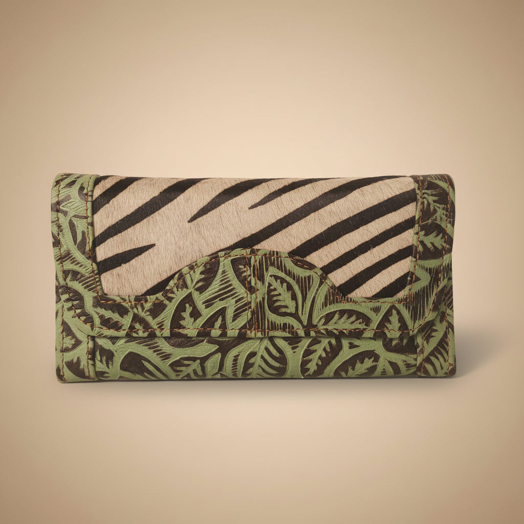 Folded fabric with green and brown pattern on a white background