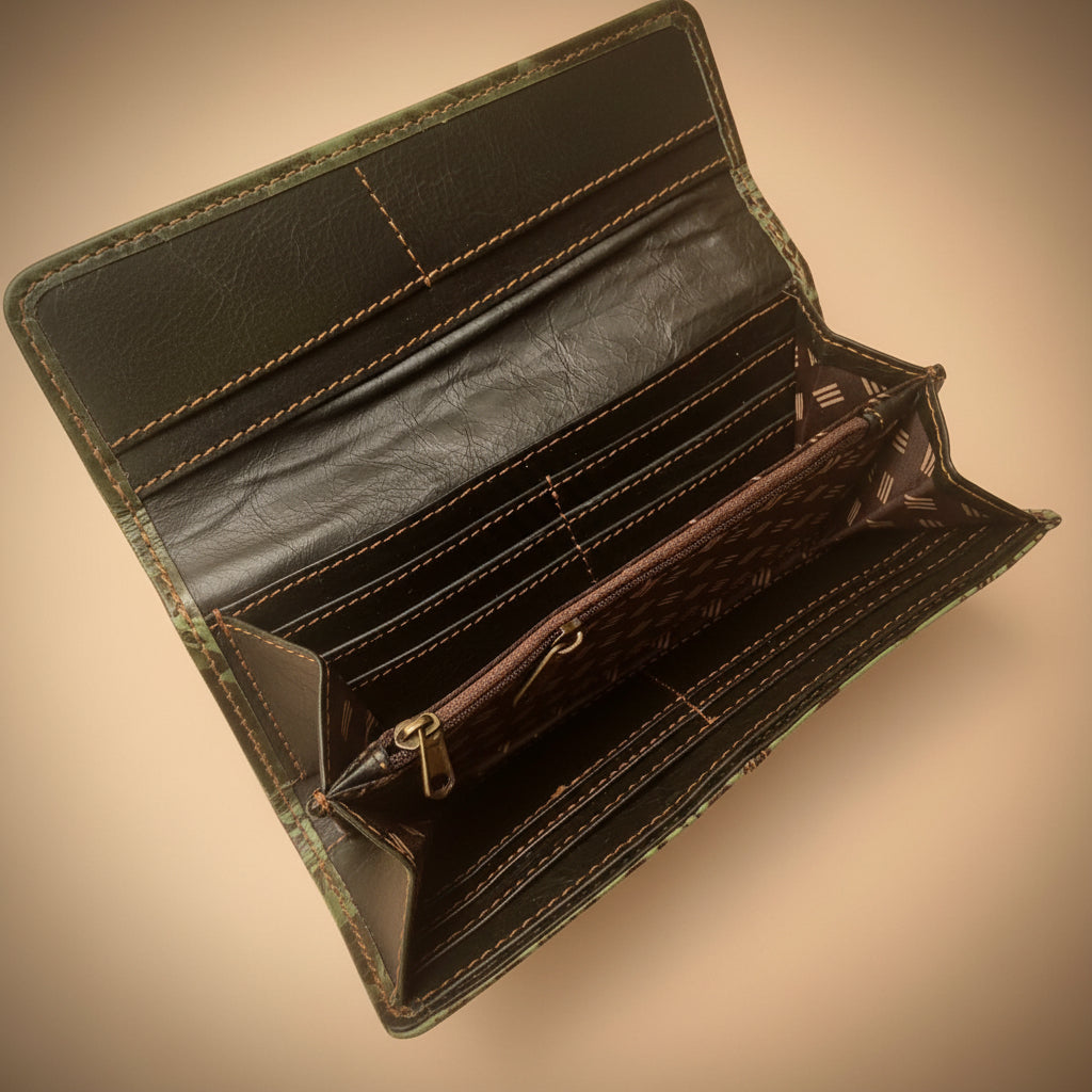 Close-up of a black leather wallet with visible stitching on a white background