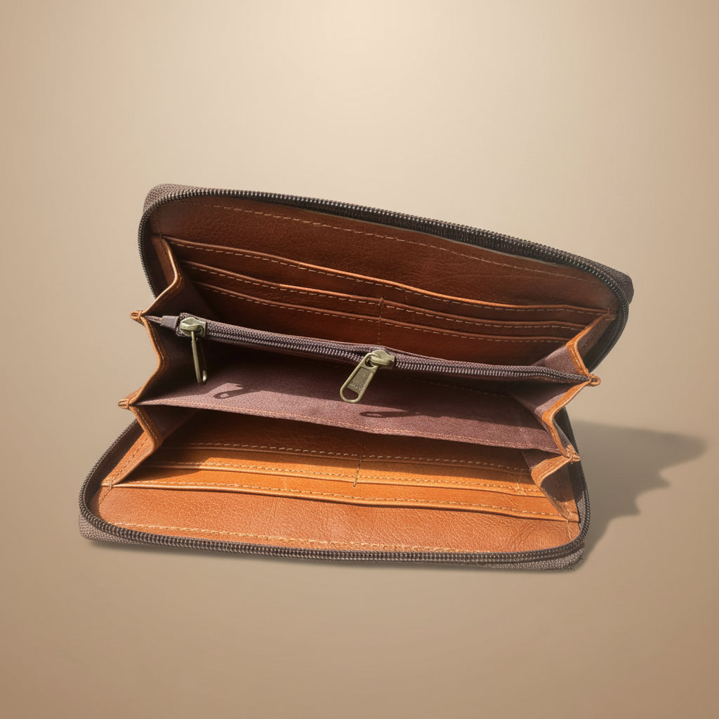 Brown leather wallet with zipper on a light gray background