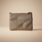 Gray textured pouch with a zipper on a light gray background