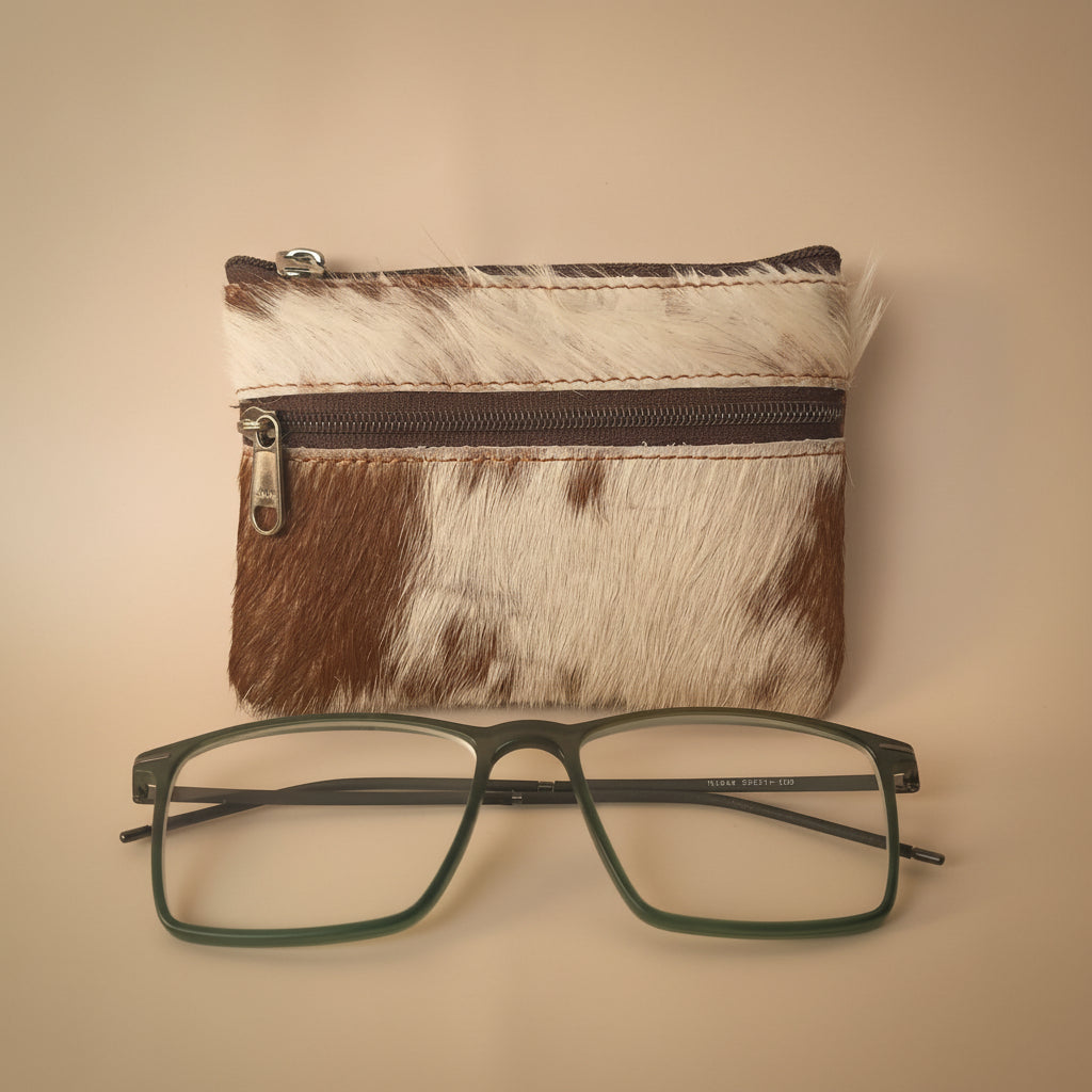 Small pouch with a zipper and a pair of glasses on a light gray background