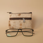 Small pouch with a zipper and glasses on a light gray background