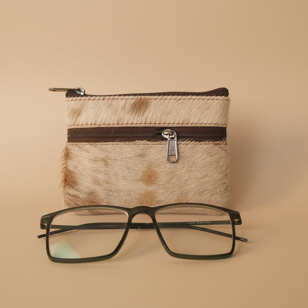 Small pouch with a zipper and glasses on a light gray background