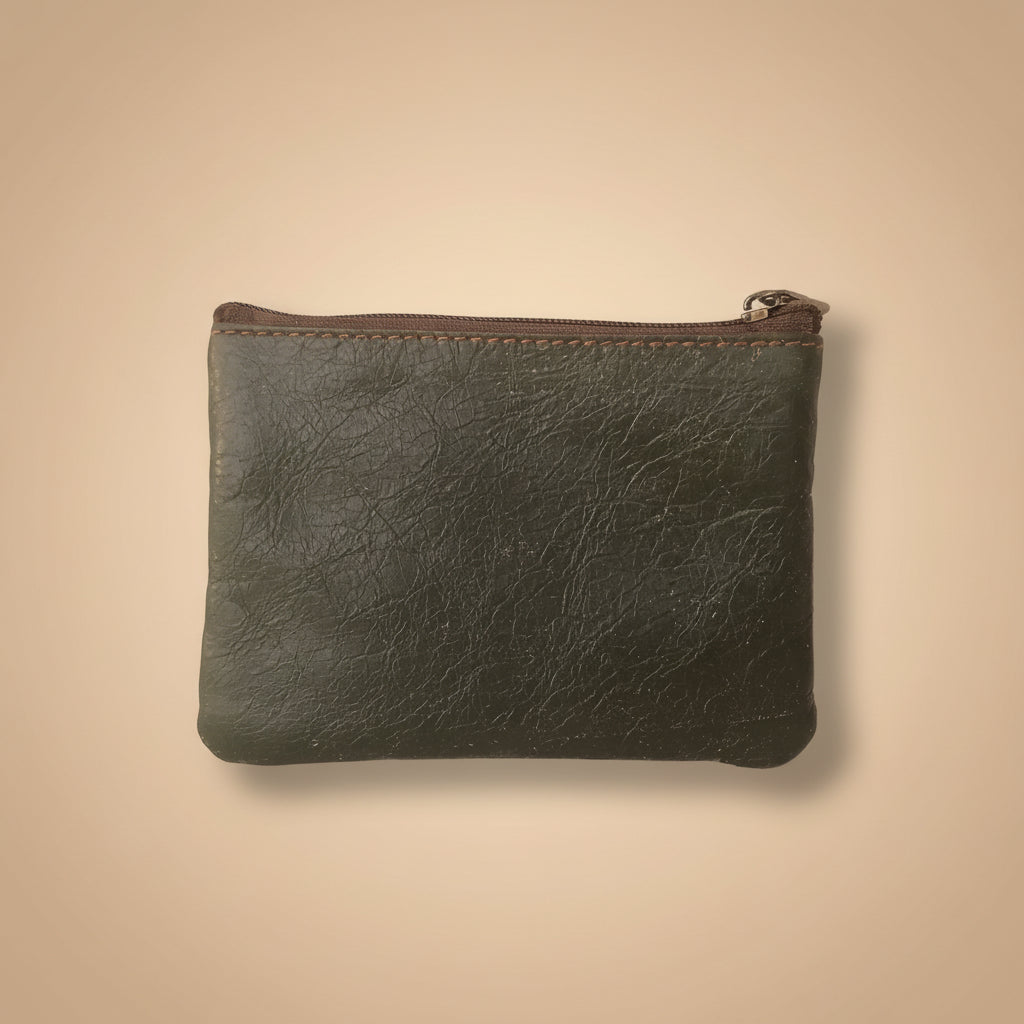 Dark leather pouch with a zipper on a light gray background