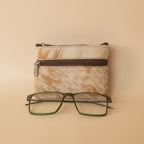 Small zippered pouch with glasses on a light gray background