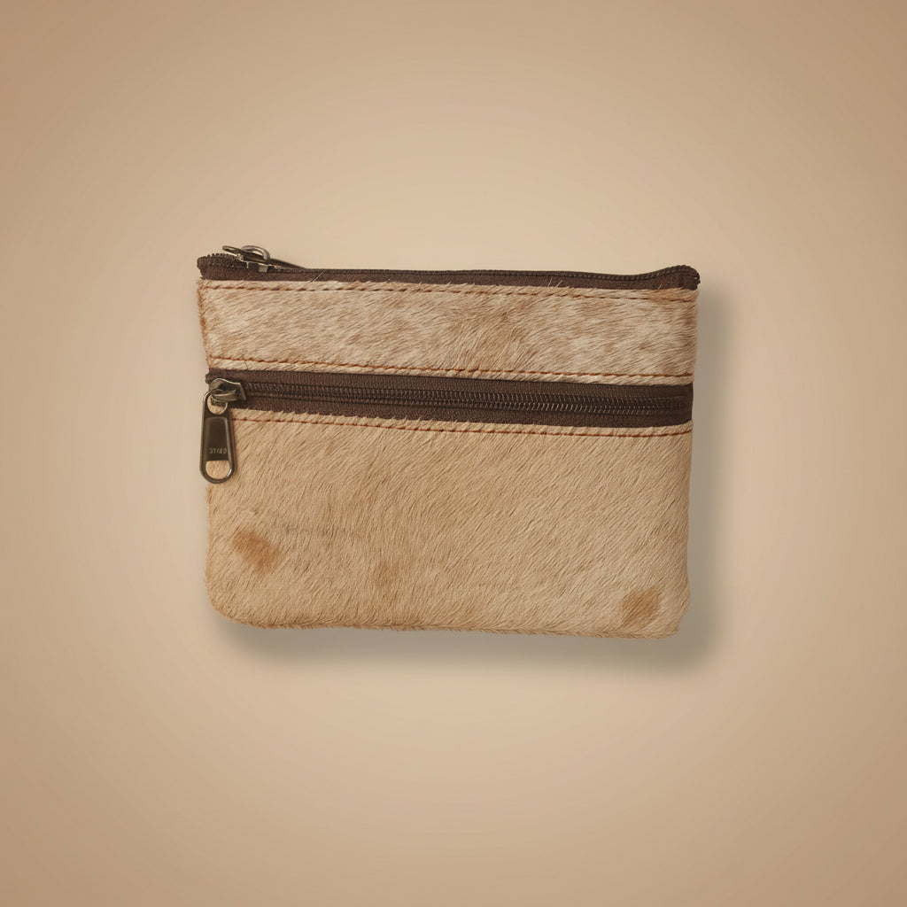 Small leather wallet with a zipper on a light gray background