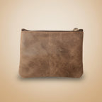 Brown leather wallet on a light gray background