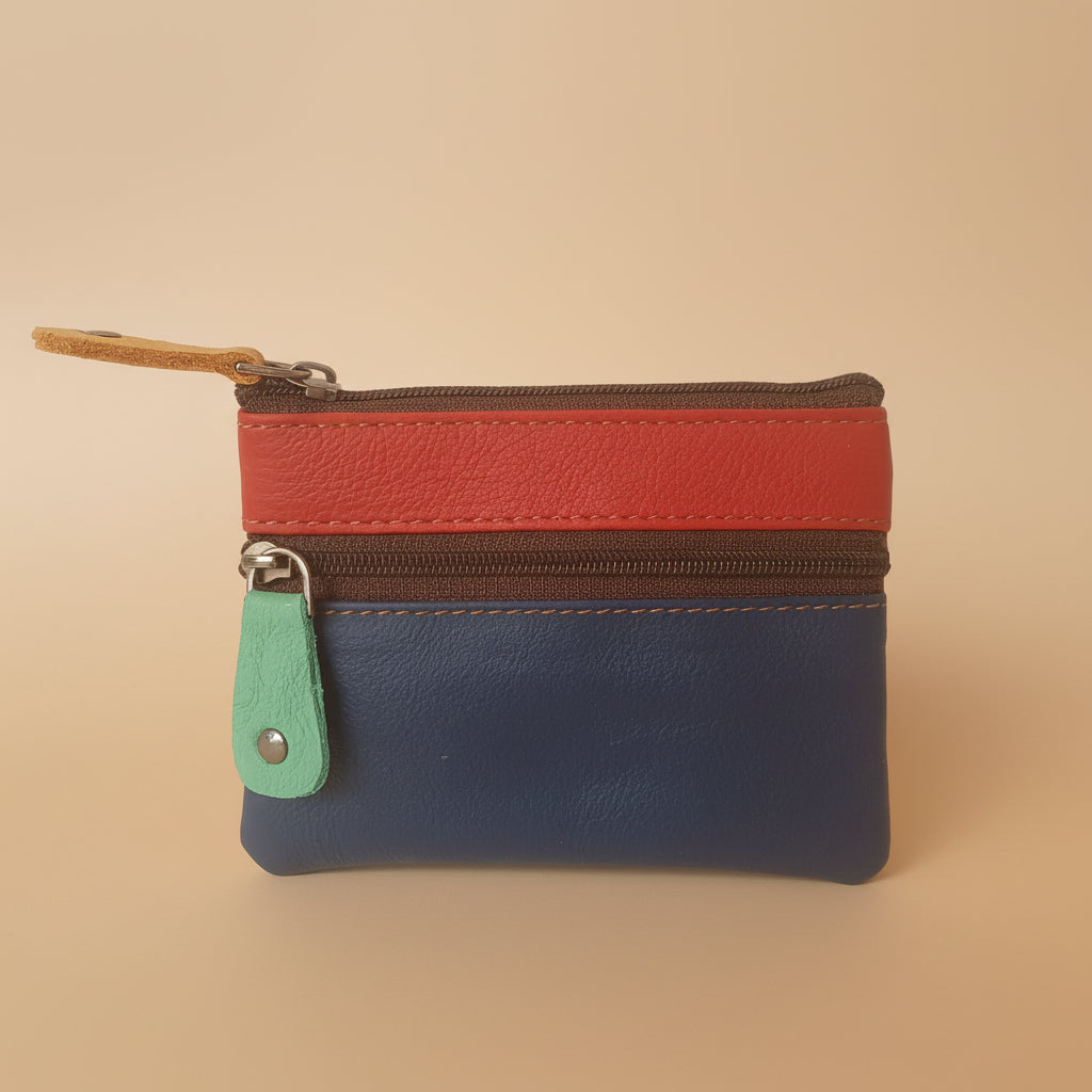 Multicolored zippered pouch with a keychain on a light gray background
