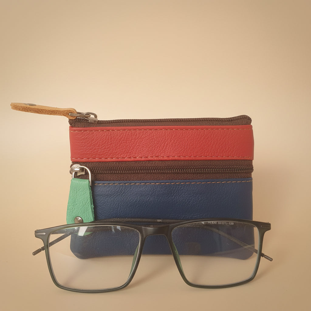 Colorful zippered pouch with a pair of glasses on a light gray background